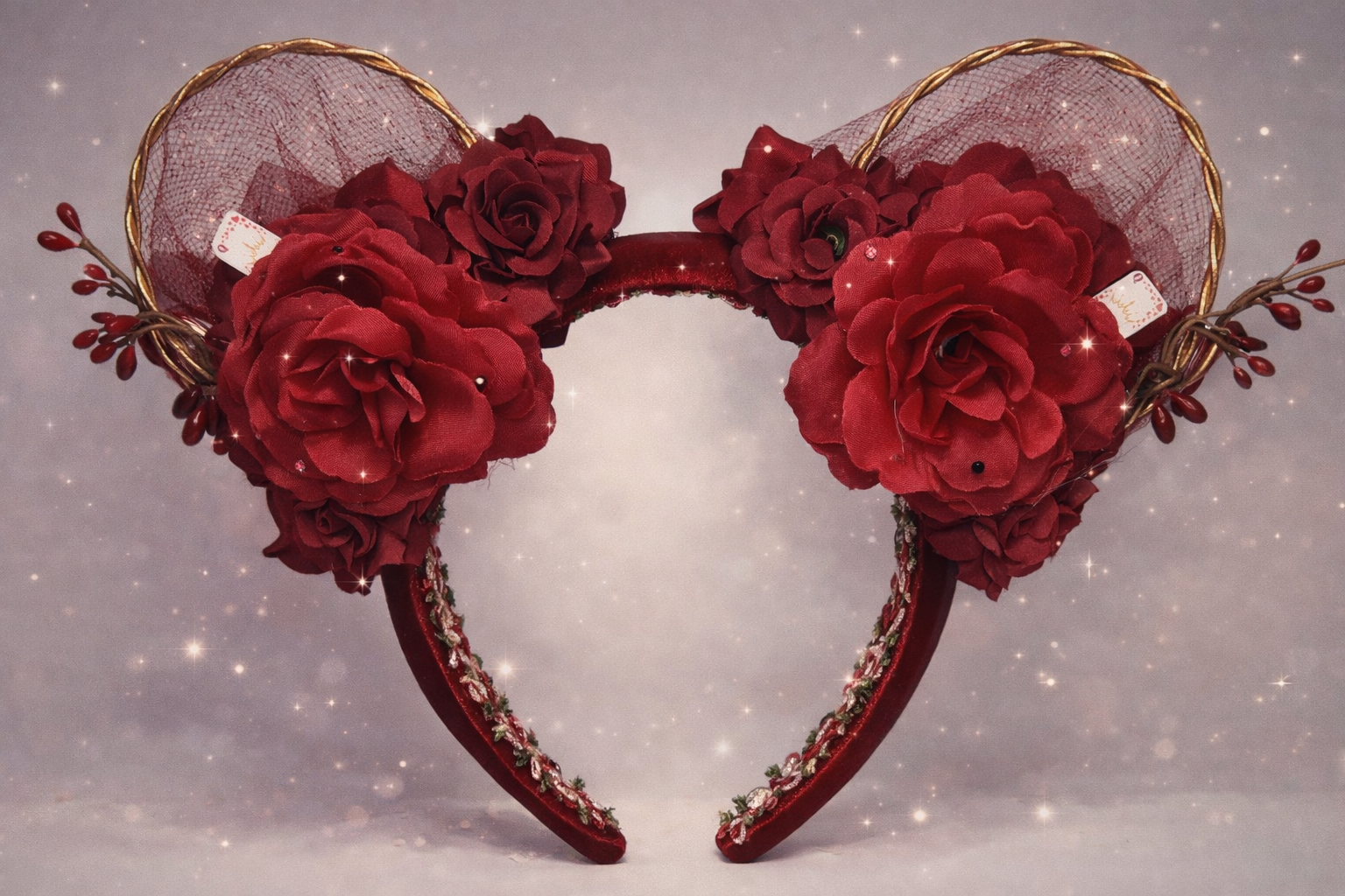 Decorative headband with red floral design on a light gray background