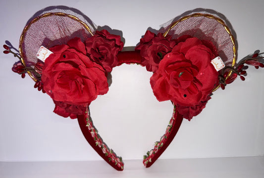 Red floral mouse ear headband with gold accents on a white background
